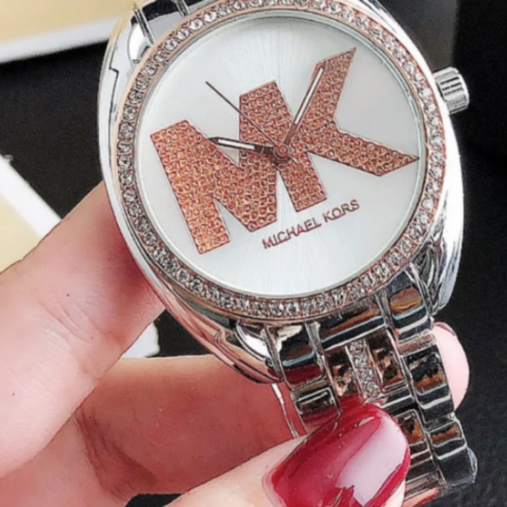 woman's rose gold  and silver watch